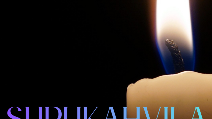kynttilä tummaa taustaa vasten